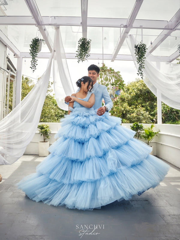 Our "Cinderella" gown, is a symbol of timeless beauty and comfort. The premium net fabric drapes like a dream, ensuring you feel as magical as you look. Its flowing silhouette captures every movement, creating captivating photos that will be cherished for a lifetime.